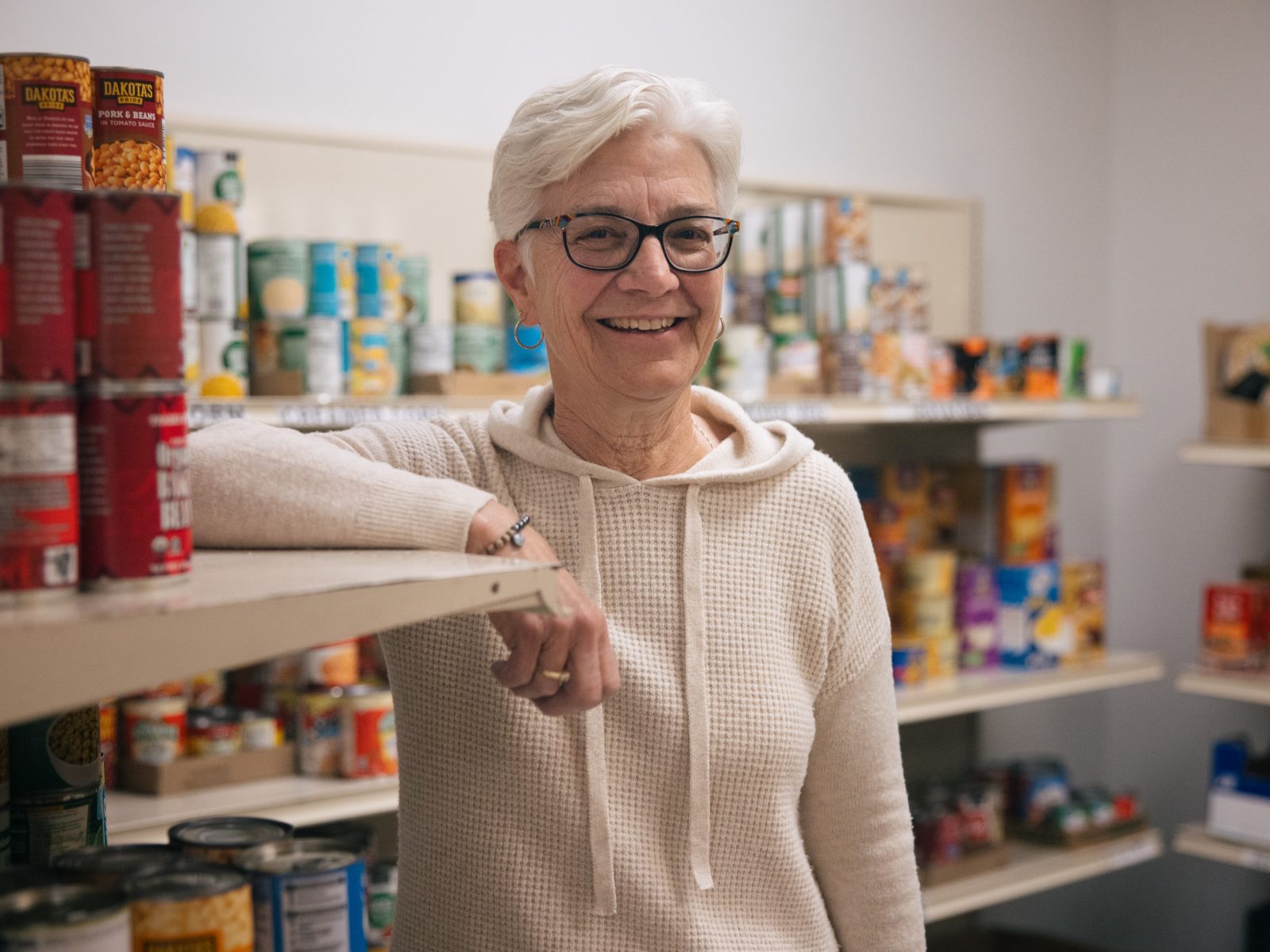 When Denise Johnson volunteers at her neighborhood food pantry every week, she’s carrying on a family tradition.

Her mother Phyllis volunteered at Southern Anoka Community Assistance (SACA) in suburban Minneapolis every Wednesday for 20 years.

Today, Phyllis lives in a memory care unit and struggles to recall moments in her life, including her decades at the pantry.

As a volunteer, Denise honors her mother’s legacy. “They remember her here,” she said. “I feel like I'm following in her footsteps.”

Her parents mentored her to become a volunteer once she retired. Her father Don volunteered, too, helping annually with holiday fundraising and distributions.

After working in respiratory therapy for 47 years, Denise retired in September 2021. Working through 18 months of the COVID-19 pandemic was “the most rewarding and difficult time of my career,” she said.

As a volunteer at SACA, an agency partner of Second Harvest Heartland, she assists her neighbors as they shop the client choice pantry.

She loves to see the “smiles on their faces” as they do “their own grocery shopping, which is a fundamental thing that we all get to do,” she said.

“I live in the community, and I knew I wanted to do something to support Columbia Heights and Anoka County,” she said. Hunger “is here, and it’s in every community.”